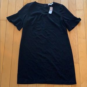 Black shift style dress with sleeves